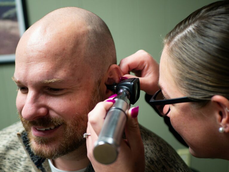 a man's ear being examined